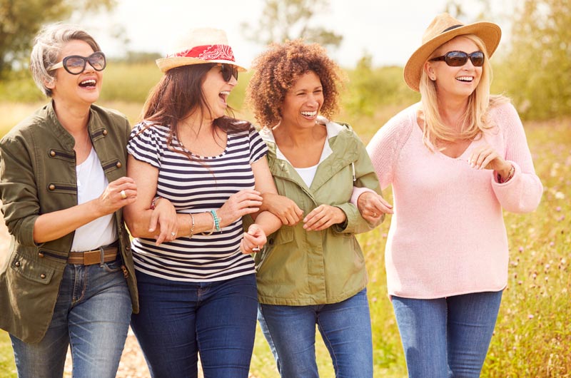 diverse middle aged women walking together
